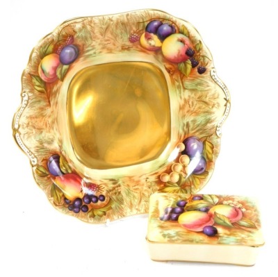 Two items of Aynsley Orchard Gold pattern wares, all painted with fruit by D Jones, comprising a rectangular trinket dish, with green Aynsley stamp, 4cm high, 12cm wide, 8cm deep, and a bread plate, with gold lustre centre, gilt border, 26cm x 23cm. (2)