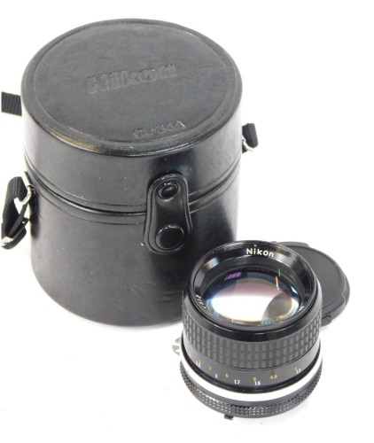 A Nikon F 85mm F2 lens with case.