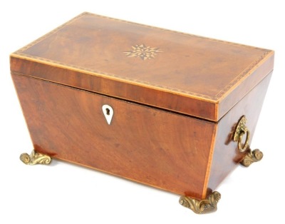 A Georgian mahogany and inlaid tea caddy, the marquetry inlaid lid opening to reveal two compartments flanking a mixing bowl recess, with cut glass bowl, raised on brass scroll feet, 16cm x 30cm x 19cm.