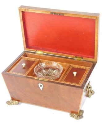 A Georgian mahogany and inlaid tea caddy, the marquetry inlaid lid opening to reveal two compartments flanking a mixing bowl recess, with cut glass bowl, raised on brass scroll feet, 16cm x 30cm x 19cm. - 2