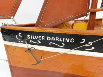 A wooden scale model of a traditional fishing boat, Silver Darling, Lowestoft, with fully rigged sales and a fitted deck, raised on a wooden stand, 118cm wide. - 2