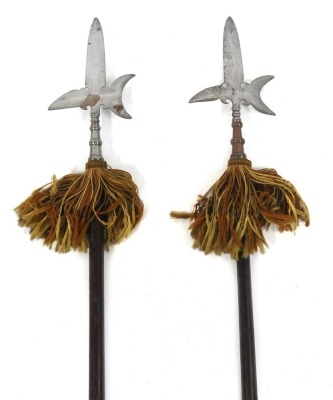 Two mid 19thC steel ceremonial Halberds, with wooden shafts, 237cm and 236cm high.