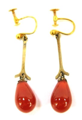 A pair of orange agate drop earrings, each formed as a teardrop, with plated drop, on yellow metal hoop and top, with screw back, stamped 9ct, 4g all in.