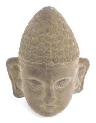 A 19thC carved stone Buddhistic head, 17cm high. Provenance: The Great House Collection, Kegworth. Acquired at auction over 40/50 years ago, sale is unknown. This lot is to be sold WITHOUT RESERVE.