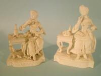 A pair of 19thC German bisque porcelain figures of ladies beside tables of fruit
