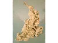 A 19thC German bisque figure of a neo-classical male in a chariot