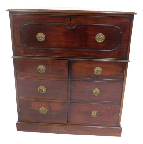 An early 19thC mahogany side cabinet or chest, with single drawer over two doors with faux drawer fronts, oval brass loop handles, 98cm wide.