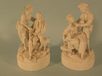 A pair of 19thC German bisque figures of a gentleman and lady beside a