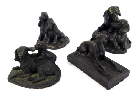 Four bronzed effect animal figure groups, comprising three of dogs, 10cm wide, and a figure of a seated Greyhound, 12cm wide. (4)