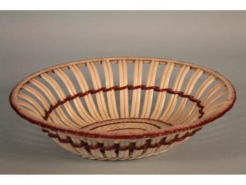 A 19thC pearlware basket decorated with puce bands (a/f)