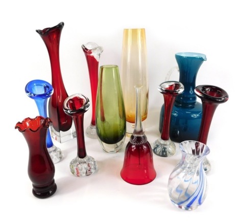 A group of decorative glassware, to include a Caithness blue swirl vase, a turquoise jug, domed paperweight bud vases, cranberry glass bell, etc. (1 tray)