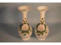 A pair of Victorian white opaque glass bottle shaped vases