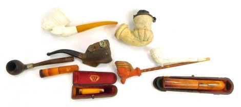 A group of smoking collectables, to include a 9ct gold rimmed amber cheroot holder, Meerschaum and amber pipe, snuff mull, etc. (1 tray)