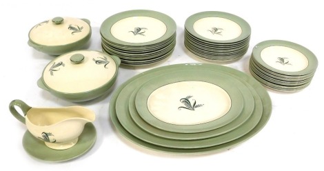 A Copeland Spode Olympus pattern pottery part dinner service, comprising two tureens and lids, four graduated meat plates, gravy boat and saucer, twelve dinner plates, four soup bowls, eight medium plates and twelve side plates.