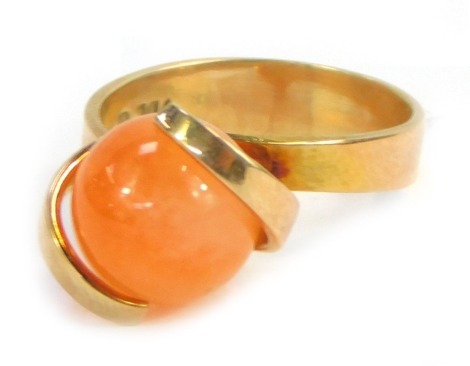 A 9ct gold dress ring, set with swivel orange agate in two claw tension setting, size M, 4.8g all in.