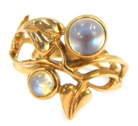 A 9ct gold dress ring, formed as vines and leaves, and set with two moonstones, size L, 3.2g all in.