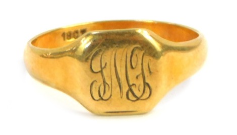 A signet ring, with square set panel bearing the initials JMJ, yellow metal stamped 18ct, size L, 3.1g.