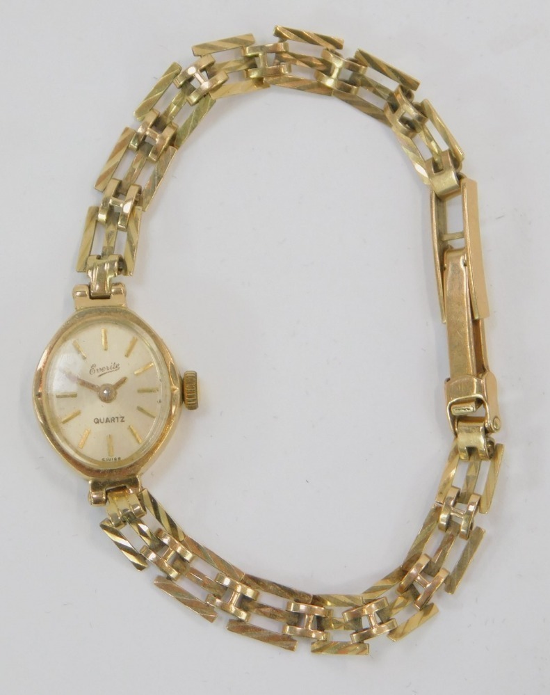 A 9ct gold Everite lady s wristwatch with small oval watch head on three bar bracelet the dial 1cm wide 8.1g all in