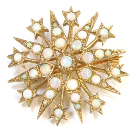 A 9ct gold and opal star brooch, formed as a star with markers, on a single pin back, 3cm wide, 6.6g all in.