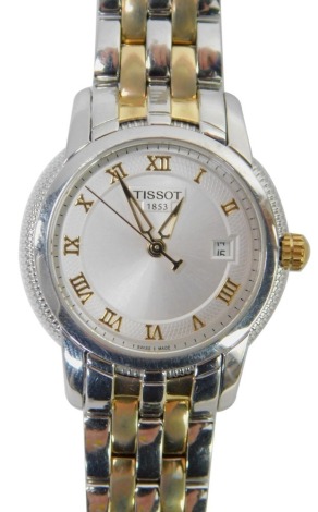 A Tissot lady's wristwatch, with a silvered Roman numeric dial and date, bi-colour stainless steel bracelet, in a Tissot branded box, 2.5cm diameter.