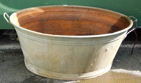 A substantial galvanised dolly tub, 46cm high, 102cm wide, 83cm deep.