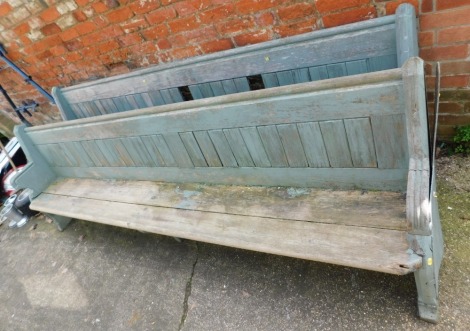 Two Victorian painted pine garden pews, 88cm high, 272cm wide, 42cm deep. (AF)