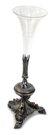 A Victorian silver plate and cut glass trumpet shaped vase, raised on a leaf cast and fluted stem over three dolphin and leaf supports, on shell feet, 32cm high.