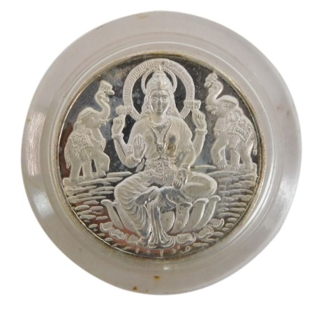 An Indian silver Lakshmi coin.