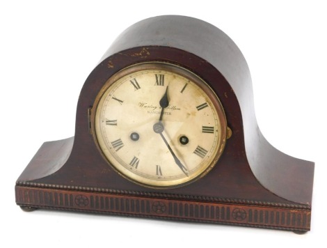 A 1920's mahogany cased Napoleon's hat mantel clock, for Waring & Gillow, Manchester, with a silvered Roman numeric dial, eight day movement with coil strike, raised on bun feet, 23cm high.