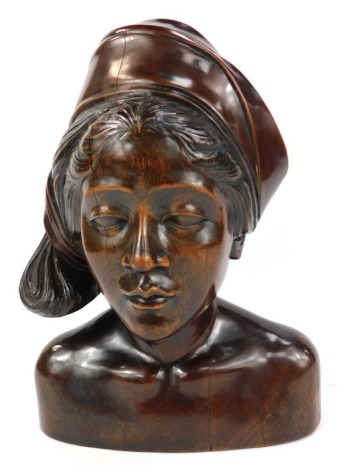 An early 20thC carved hardwood bust of a lady, identified by a label on the base as Winifred E K Burtt, believed to have died in Malaya before 1939, 25cm wide.