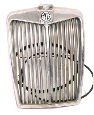 A chrome front grille, for an MG motor car.