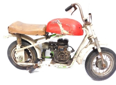A Fantic Motor monkey bike, 50cc, 1969 Fantichino, with red fuel cover and a brown leather seat, 71cm high, 94cm wide.