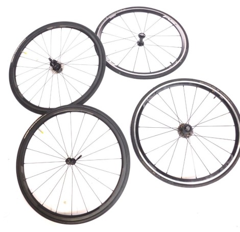 Four spare bike wheels, to include a two Shimano RS, Prime 020. (4)