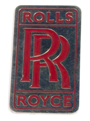 A Rolls Royce car badge.