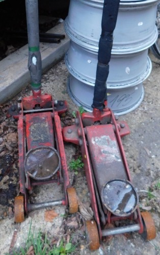 Two heavy duty red 5 ton car jacks.