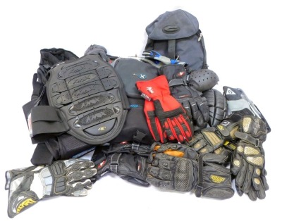 A collection of motorcycle accessories, to include leather gloves, ruck sacks, hats, bags, knee pads, etc. (2 boxes)