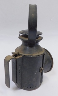 A railway inspection lantern, with black metal casing, with a circular glass dial, 30cm high. - 2