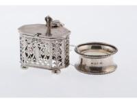 An octagonal lidded silver mustard pot