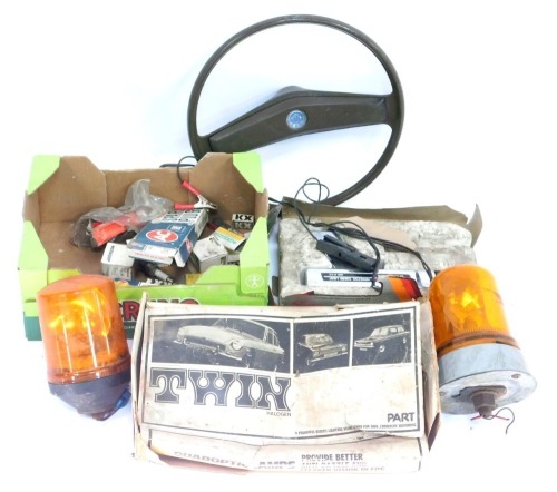 A Leyland steering wheel, various spark plugs, a Suntune indicative timing light, orange warning lights, beams, etc. (a quantity)