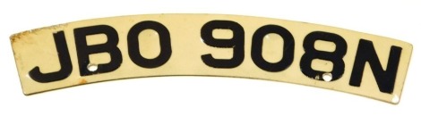 A motorcycle number plate, arched and stamped JBO 908N, 30cm wide.