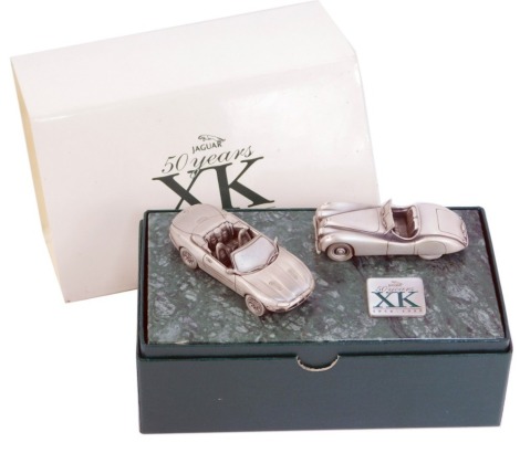 A Jaguar XK 1948-1998 two car diecast model, on marble plinth, in presentation box, 17cm wide.