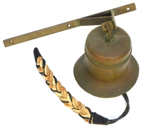 A brass hanging ships bell, with wall mounted bracket, 42cm high, the bell 25cm high, unmarked.