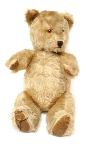 A mohair musical Teddy Bear, with opposable arms, 32cm high.