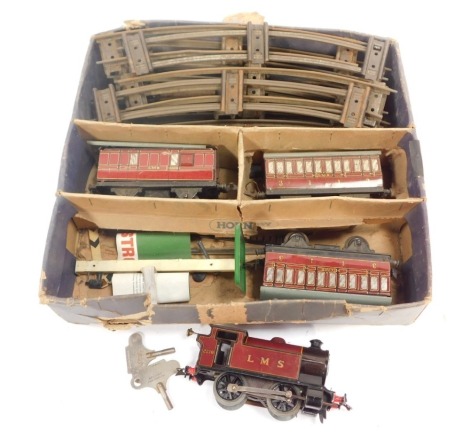 A Hornby Meccano O gauge clockwork tinplate train set, including Type 101, LMS 0-4-0 clockwork locomotive, LMS crimson, three LMS crimson coaches, signal and track, in associated box.