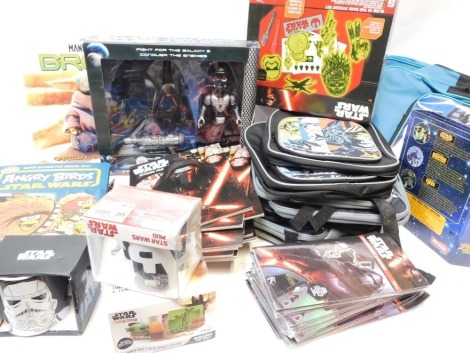 Star Wars memorabilia, to include Star Wars back packs, Star Wars Glow in the Dark sticker set, Star Wars The Mandalorian egg cup and toast cutter, Star Wars Stormtrooper mug, calendars, annuals, etc. (2 boxes)