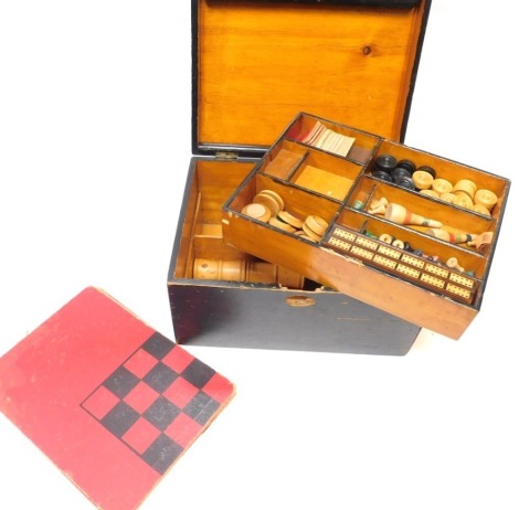 A games compendium, in ebonised box, including game boards, Chequers, Cribbage board, etc.