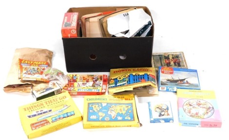 A group of toys, games and jigsaws, Things That Go, Spelling Pictures, Telling Jigsaws, building blocks, etc. (1 box)