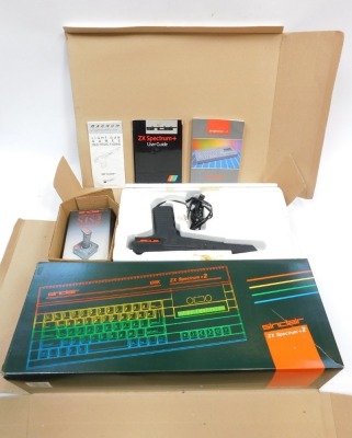 A Sinclair ZX Spectrum +2 Action Pack, including ZX Spectrum +2 light gun, instruction manuals, user guides, boxed.