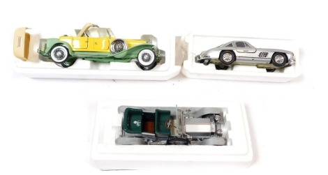 Franklin Mint diecast cars, including a Rolls Royce Silver Ghost, Mercedes Benz 300SL Gull Wing, and a Gary Cooper's Original 1930 Duesenberg J, boxed. (3)