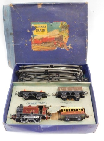 A Hornby O gauge train set, with LMS crimson locomotive 0-4-0 2270, first class coach, five plank wagon, flat wagon, and track, boxed.